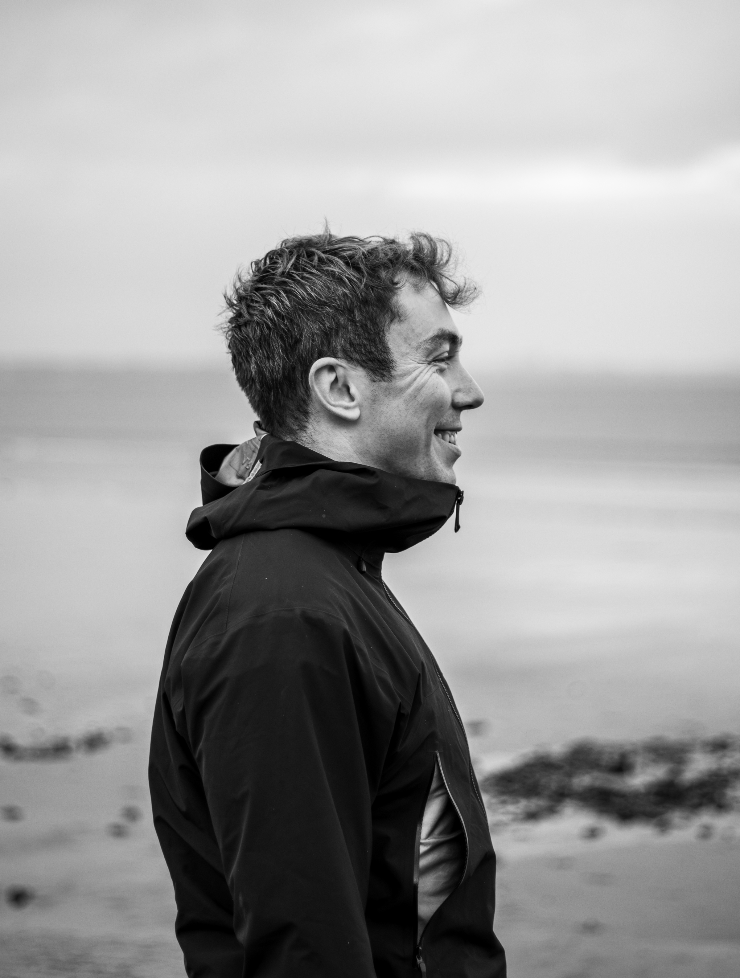 Solo portrait in Patagonia jacket at beach